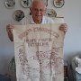 Charles Baumann with 555th Banner